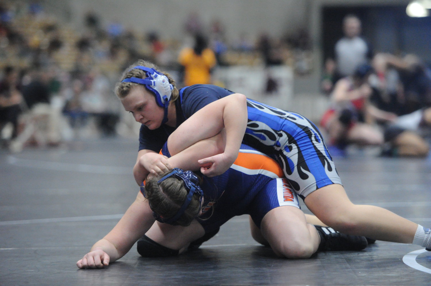 Danika Mealer repositions for two points and pins her opponent shortly after in her tournament opener in the Girls 185-pound class.