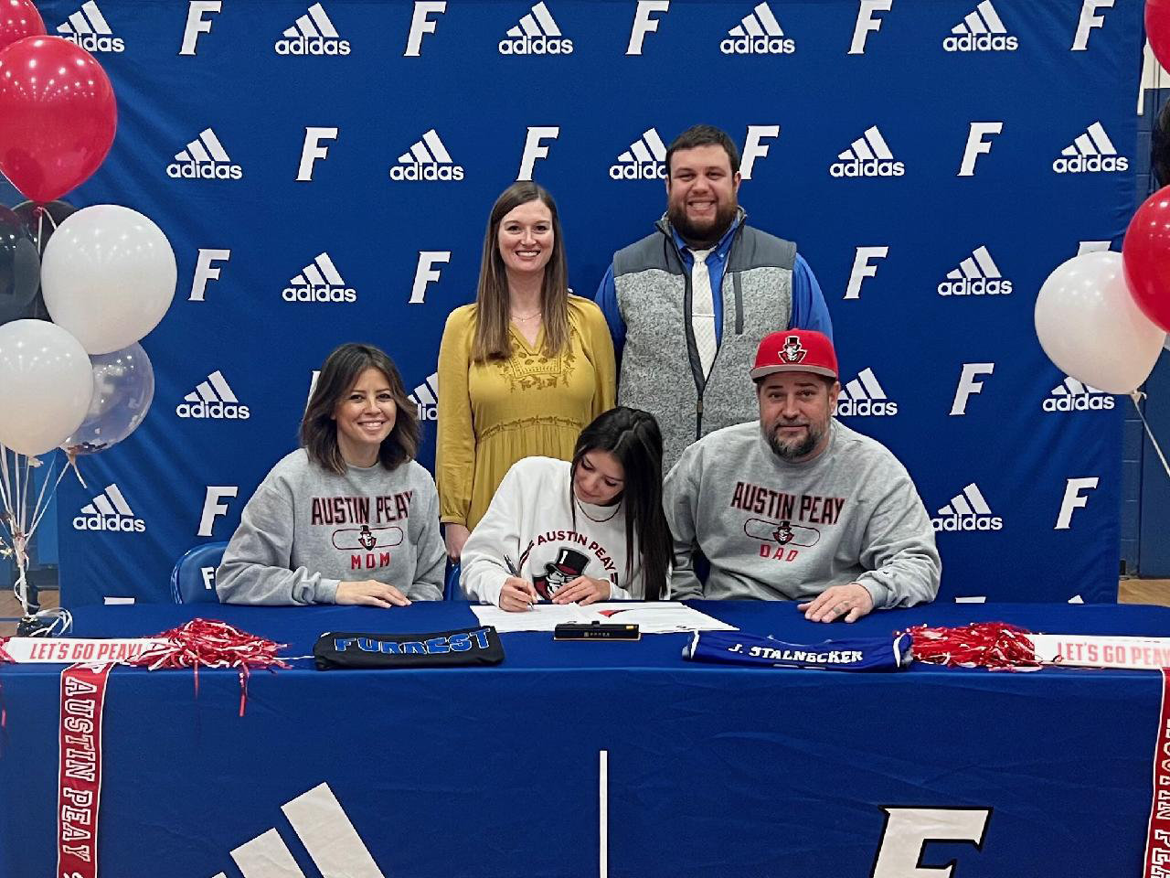 Jaedyn Stalnecker signs her letter of intent to continue her cross country career at Austin Peay State University.