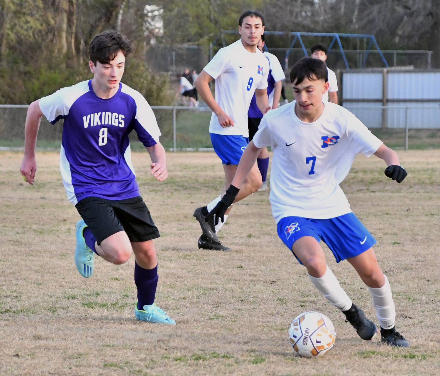 Imar Pineda (7) of the Tigers controls the ball with Brody Ray (8) of the Vikings in pursuit. Pineda had the tying goal for Marshall County.