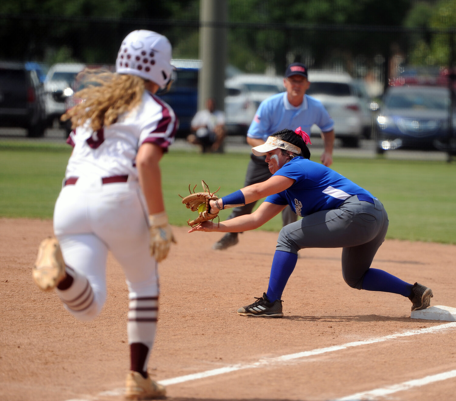 Carli Warner puts the squeeze on a throw to first for the out against Alcoa.