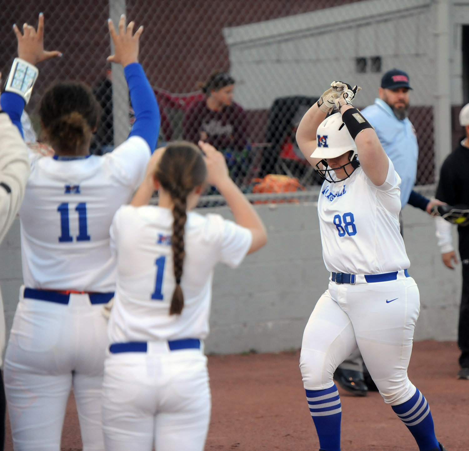 Richardson nears home plate and celebrates after crushing a home run as a junior with the Tigerettes.