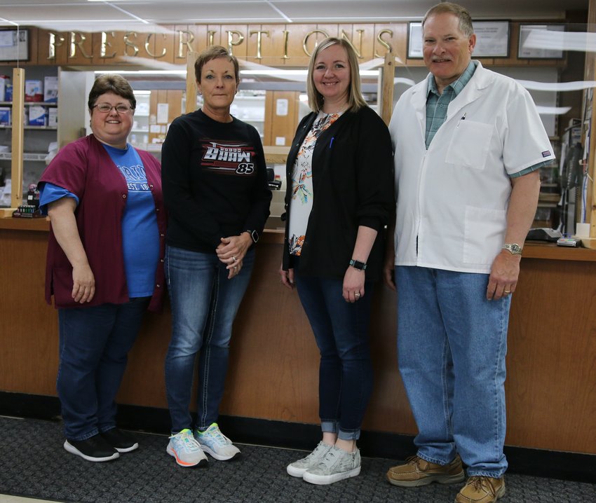 A&amp;B Prescription Shop's Toni Rose, Paula Shaw, Tina Brown and head pharmacist David Ham pose at the counter a week before the store's scheduled closing. The Webber Family of Pharmacies has purchased A&amp;B's assets and records. [Dave Faries]