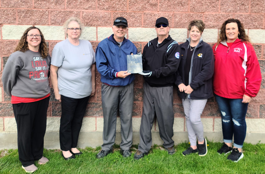 Community R-6 Athletic Booster officers recently honored Jim Brink and Mac McGrew for their contributions to the district by dedicating the district's new batting cage in their honor. Among those present at the ceremony are Amber Forbis, Cindy Fort, Brink, McGrew, Dana Robnett and Mandy Cope. [Vicki Duenke]