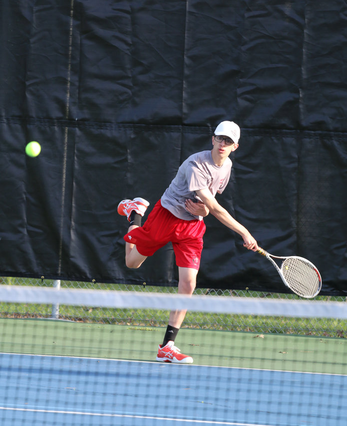 Ryan Pemberton returns a shot during his 10-2 win over Moberly's William O'Laughlin.[Dave Faries]