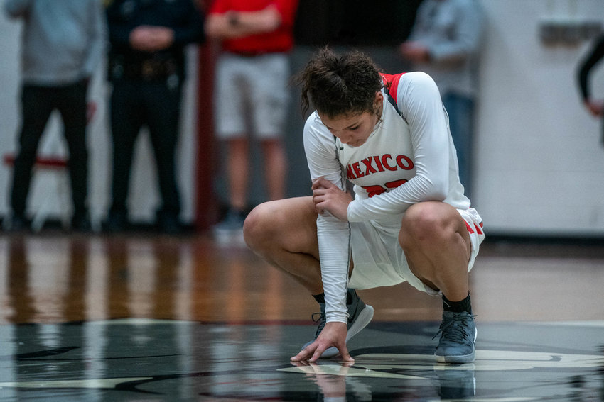 Mya Miller pauses late in the game to reflect on the situation during Thursday's loss to Kirksville in the district championship game. [Eric Mattson]