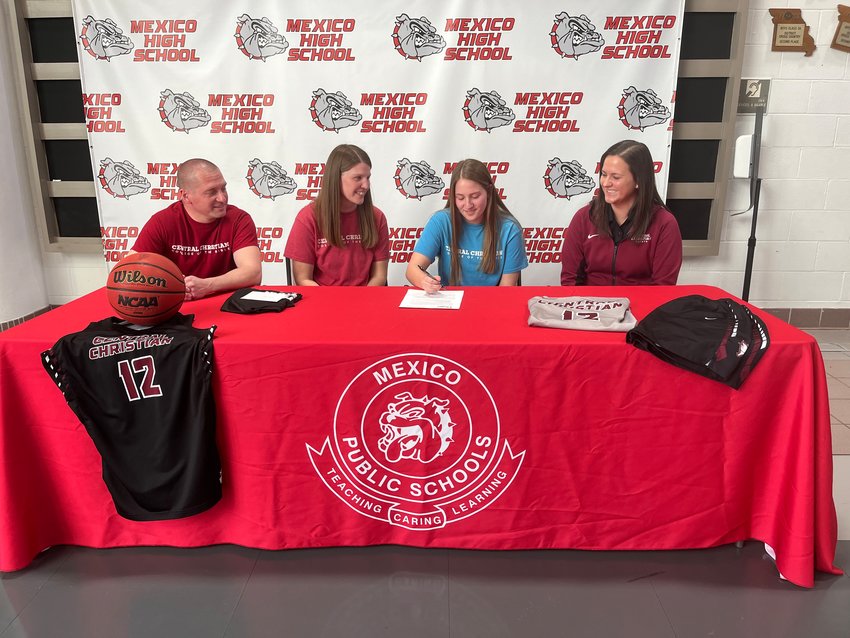 Shelby Kennemore is joined by her parents Steve and Sarah Kennemore and Central coach Kori Zarzutzki as she signs her letter of intent. [Submitted Photo]