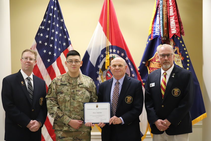 MMA President Richard V. Geraci presents a certificate to recognize Cadet Peter Didicher&rsquo;s selection as the recipient of the Missouri S&amp;T Jackling Introduction to Engineering Summer Camp scholarship, sponsored by Chris Schafer, MMA Class of 1989. From left, they areMMA science instructor Michael Pemberton, President Geraci, Cadet Didicher, and Schafer. [MMA Photo]