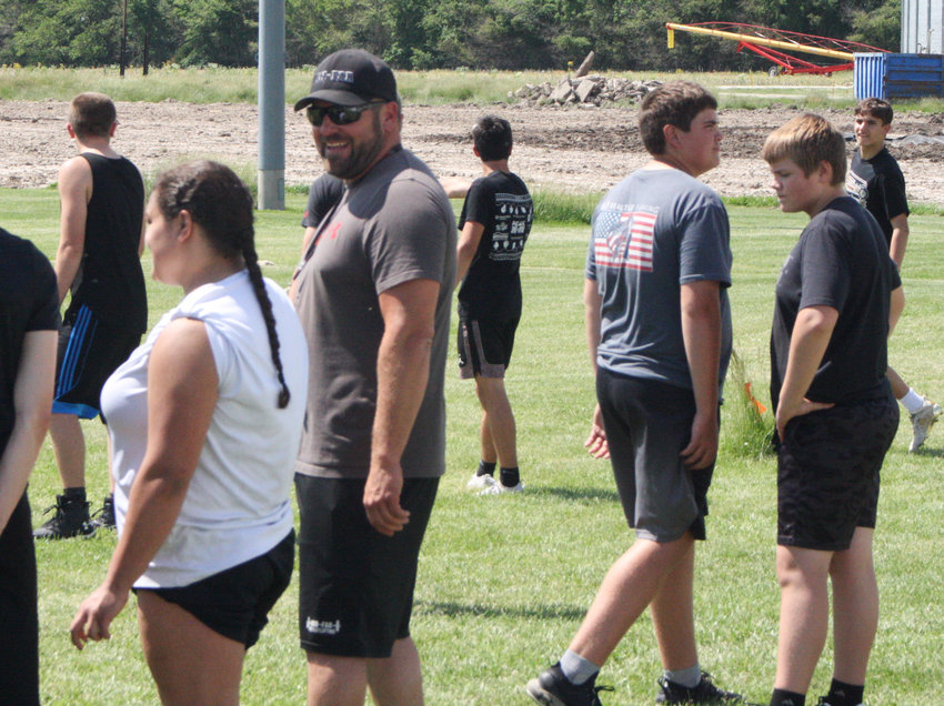 Lucas Gibson talks with his players Monday during a practice at Van--Far High School in Vandalia. Gibson was hired as the third head football coach in as many seasons.