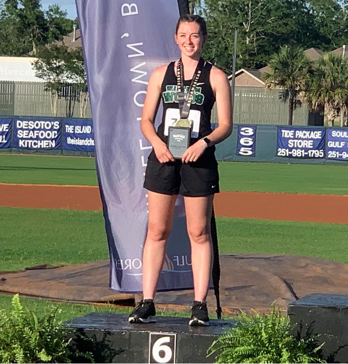 William Woods athlete and Community R-6 alum Natalie Thomas stands on the podium May 26 at the NAIA national championship meet in Gulf Shores, Alabama, after earning All-American honors in the javelin. Thomas is the first William Woods woman to be an All-American in the event.