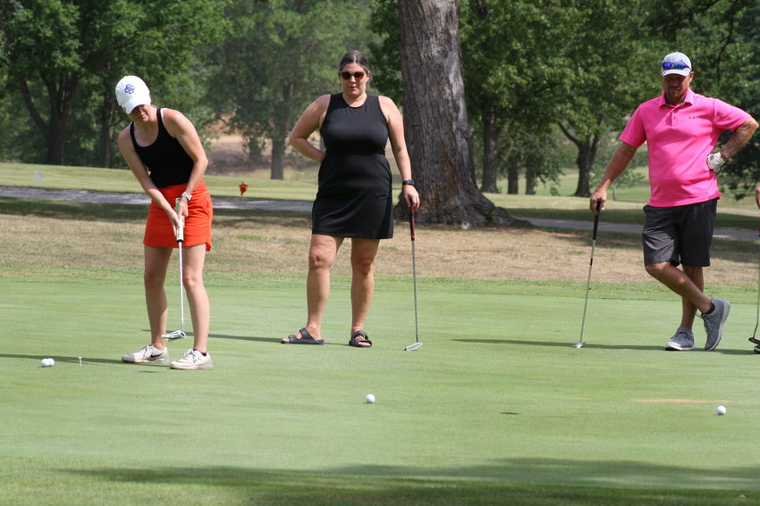 Mexico girls golf head coach Layne Ray putts on The Oaks golf course July 16 during the Bulldog Golf Classic. Ray, John Knipfel and Mexico boys golf head coach Becca Bates collaborated to organize event to raise money for the high school golf programs.