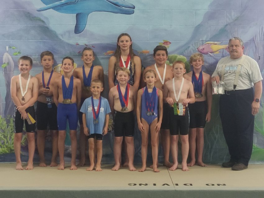 Mexico YMCA swimmers attended the Mid-Mo Conference Championships held July 9 in Fulton and came home with many medals, ribbons and broken records. Pictured in the back row, from left, Brooks Lamb, Trey Burle, Zee Love, Sebastian Matuz, Seth Stevenson and coach Matthias McManus; in the middle row, from left, are Gabe Marquette, Chase Burle, Cody Duff and Austin Duff; and in the front row, from left, are Logan Sharpe and Aubrie Burle. Not pictured are Ronin Watson, Avery Sharpe, Alexia Femrite, Taylor Carr, Samantha Stoldt and Rayne Harned.