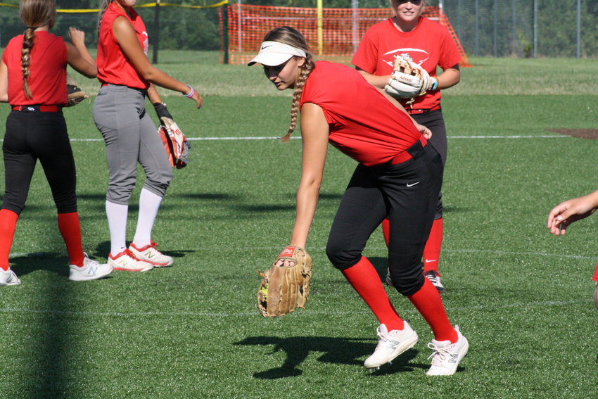Mexico senior first baseman Kierstan Epperson backhands a ball Wednesday in practice at Mexico High School. Epperson is one of three returning all-conference players in what the Lady Bulldogs expect to be a formidable lineup.