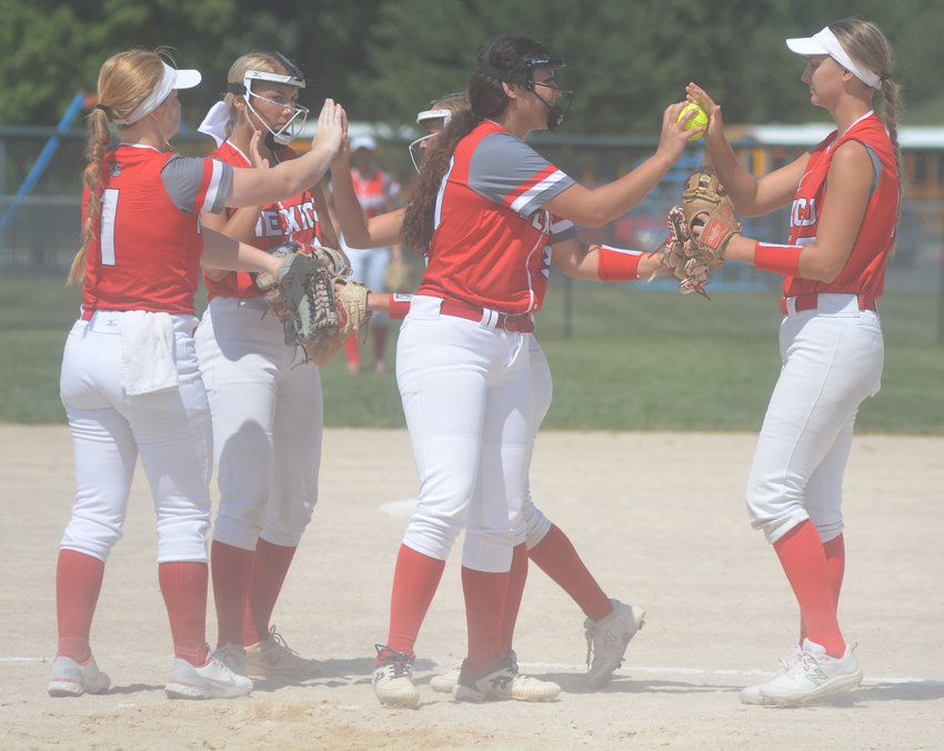 Mexico softball players celebrate after a victory in the Sullivan Back to School Tournament on Friday and Saturday. The Lady Bulldogs won three out of five games to take seventh place.
