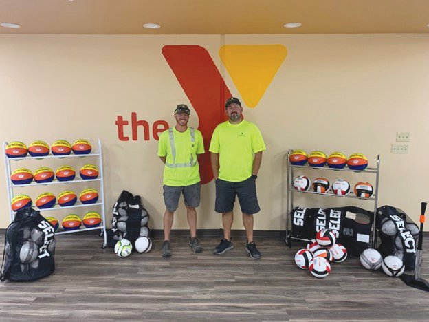 Rylee Rooks, left, and  Cole Hildebrand of Mexico contributed to the Mexico Area Family YMCA by providing a donation of sports equipment.                                                                [Submitted]
