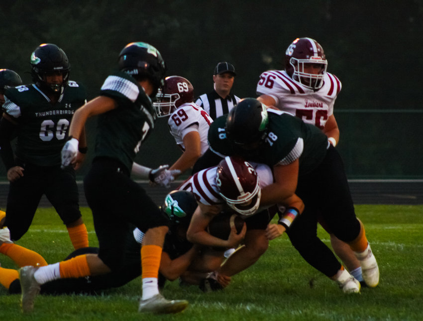 North Callaway senior defensive lineman Brandon Speight wraps up the Louisiana ball carrier on Sept. 16 at home. The Thunderbirds stopped the run Friday in a 34-22 win at Mark Twain.