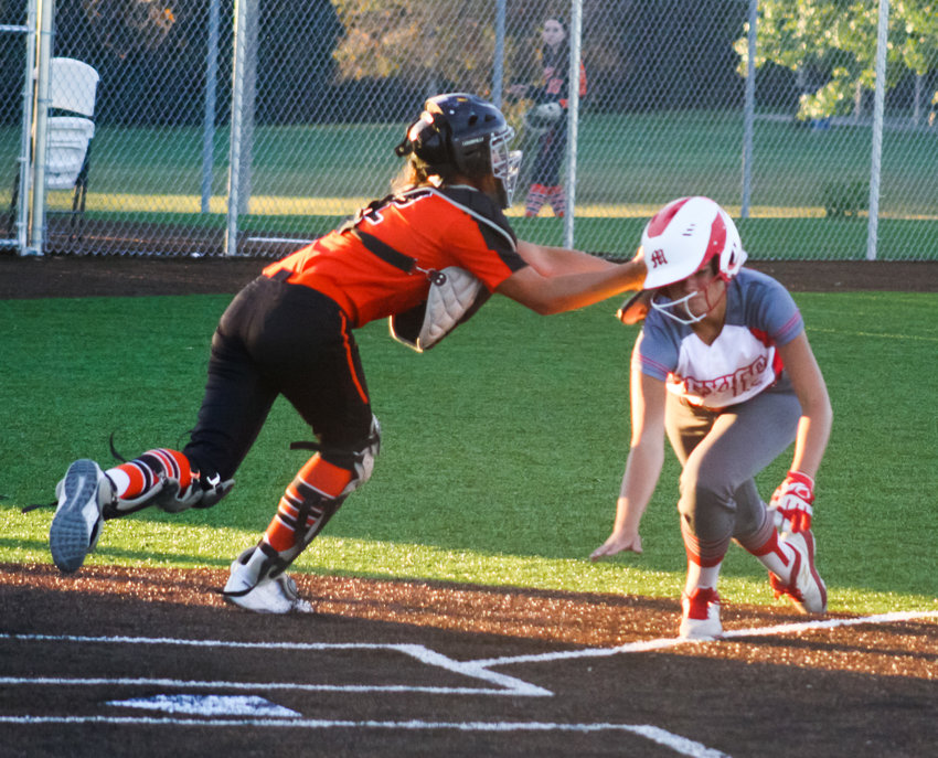 Mexico junior shortstop Karlee Sefrit is tagged out trying to score in the sixth inning Monday by Kirksville catcher Mallory Lymer. The Lady Bulldogs lost 4-3 at home to the Lady Tigers.