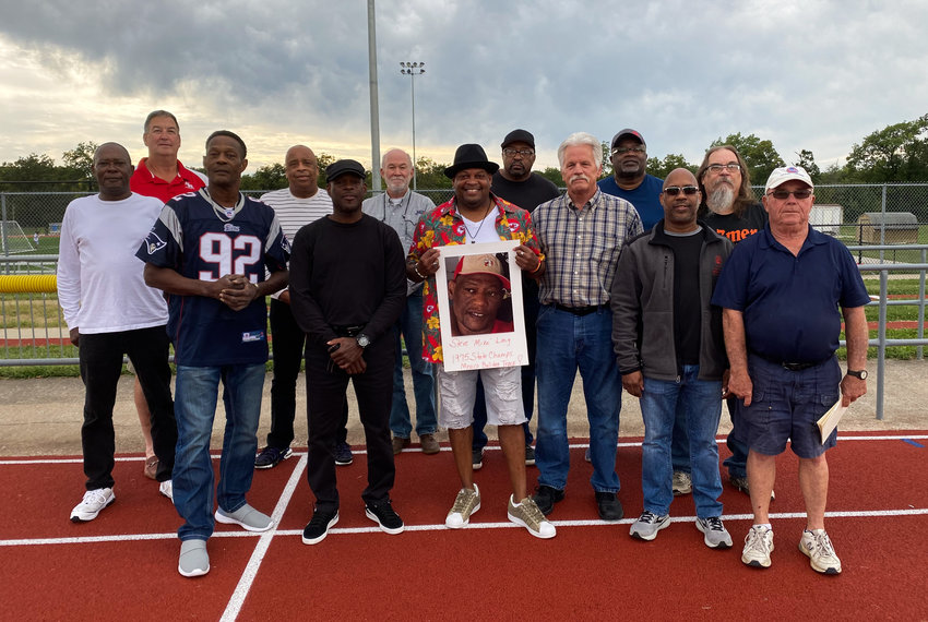 Members from Mexico track and field from 1974-79 reunited to celebrate its recent induction into the Missouri Sports Hall of Fame. In the front row, from left, is Clifton Long, Greg Jackson, Kirk Jackson (holding picture of Steve Mike Long), Regan Fuhrer, Vincent Kemp and coach Ron Whittaker. In the back row, from left, is Adrian Bradshaw, Andy Ekern, Jerry Miller, Tim Collins, Butler Nunnelly, Austin Miller and Dickey Barnes.