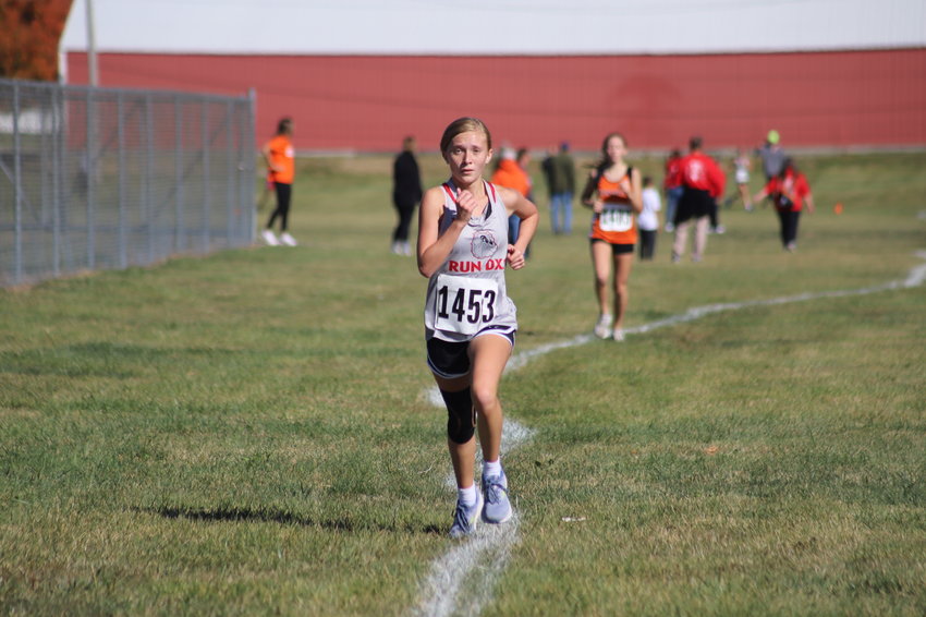 Mexico junior Kalea Henneberry finished fourth for the Mexico girls' best individual time Saturday at the North Central Missouri Conference meet at Indian Foothills Golf Course in Marshall. The Lady Bulldogs won the team title thanks to four-conference runners.