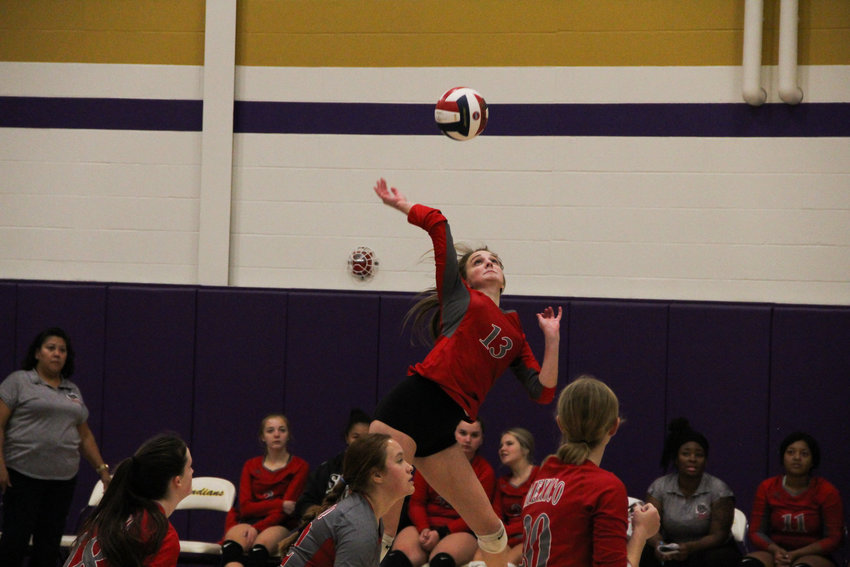Mexico senior outside hitter Jessica Stephens jumps up for a swing Thursday against Bowling Green in the Class 3 District 7 Tournament in Hallsville. The Lady Bulldogs' season was cut short, but Stephens along with two others from Mexico were named to the all-district team. Stephens was also announced as a first team all-conference selection while senior setter Ally Wilson was named as an honorable mention.