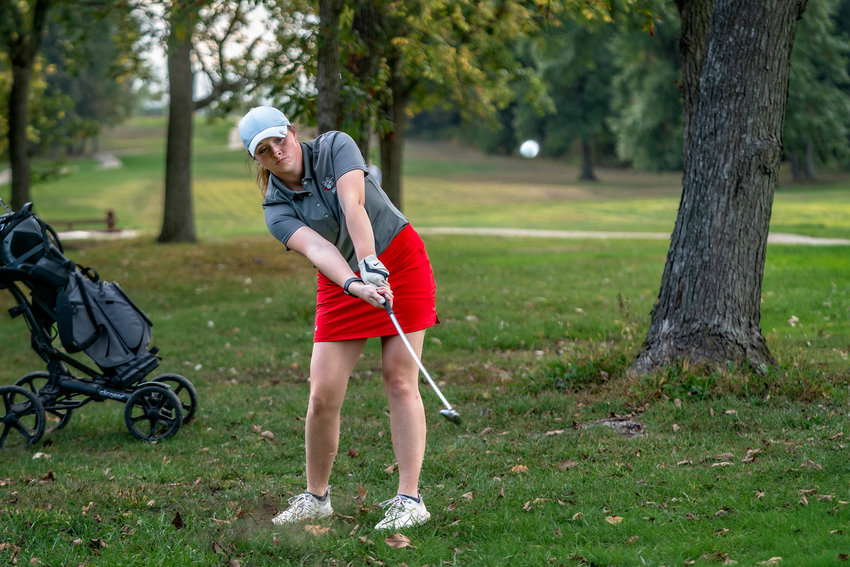 Mexico senior Kennedi Rowe chips a ball amongst the trees during an earlier meet this season. Rowe qualified for state the second straight year, finishing higher than she did a year ago.