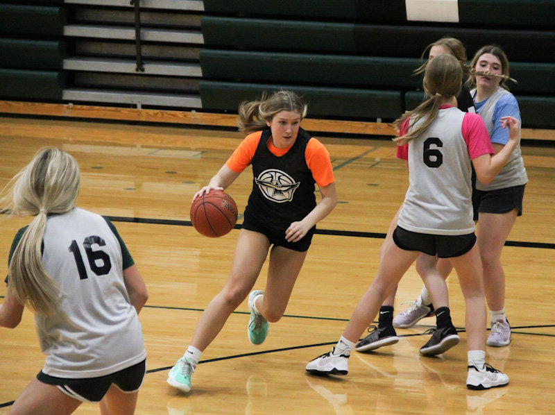 North Callaway junior Riley Blevins weaves through the defense during a Ladybirds practice at the high school in Kingdom City. Blevins and sophomore Natalie Shryock return this season as the top two leading scorers from North Callaway's team last season.