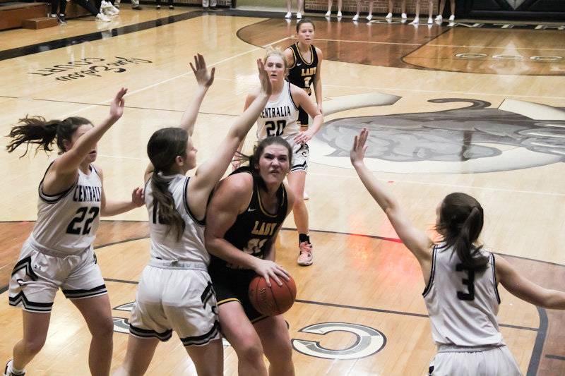 Centralia junior Raegan Anderson (12) defends Van-Far senior Mara Jensen in the post Monday during the first round of the Centralia  Invitational Tournament. Jensen finished with 16 points and 11 rebounds, and 10 Lady Panthers scored in Centralia's 66-20 victory.