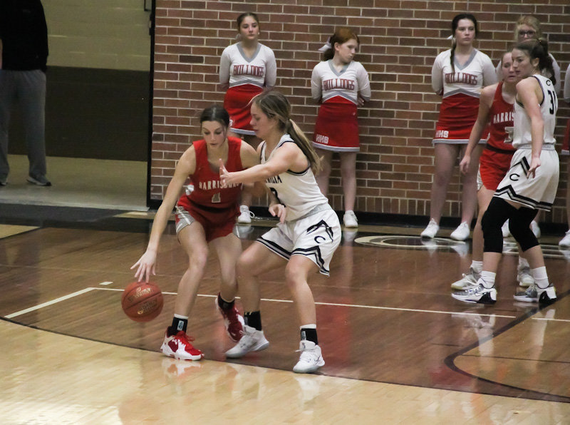 Centralia senior Harper Sontheimer blankets Harrisburg leading scorer Carli Ellis on Wednesday during the semifinals of the Centralia Invitational Tournament. The Lady Panthers' defense shut down Harrisburg 54-25 to play for the championship at 8 p.m. Friday against Hallsville.