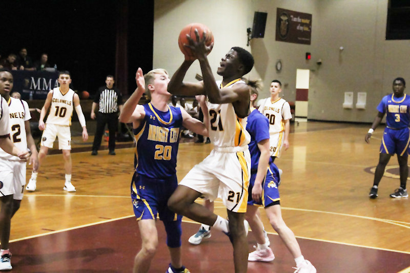 Missouri Military Academy senior Albert Ogutu goes to the rim Nov. 30 at home against Wright City. Ogutu went on a torrid scoring stretch after that game, scoring 30 points in the Colonels' latest win against Silex at home in a 71-66 double-overtime game Monday.