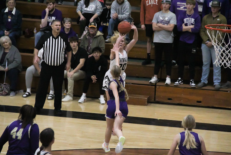 Centralia freshman Braylin Brunkhorst sends a 3-pointer over a Hallsville defender on Dec. 9 in Centralia. Brunkhorst hit an open 3-pointer at the last second to win the Lady Panthers' game against Iowa's Fort Madison 45-44