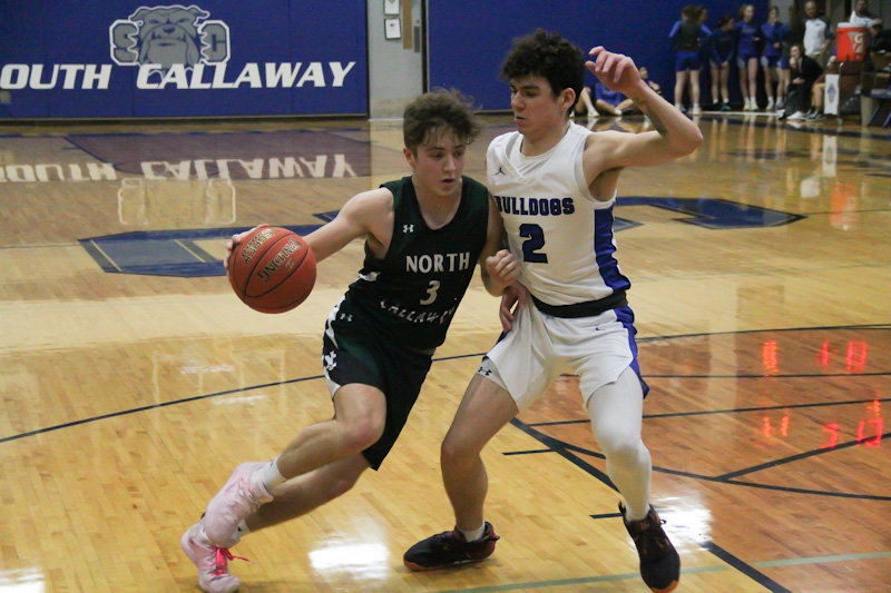 North Callaway senior Braydn O'Neal drives against South Callaway's Evan Sconce-Martin during Saturday afternoon's third-place game of the South Callaway Varsity Tournament. O'Neal finished with 14 points and six assists in North Callaway's 52-49 win.