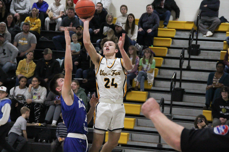 Van-Far junior Nikos Connaway lifts a shot against Montgomery County on Jan. 31 at home.