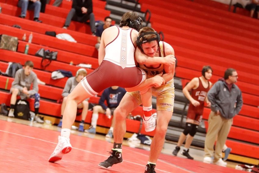 Missouri Military Academy sophomore Ryan Miles grapples with MICDS's Brian Schlafly on Jan. 28 at the Warrenton Tournament.