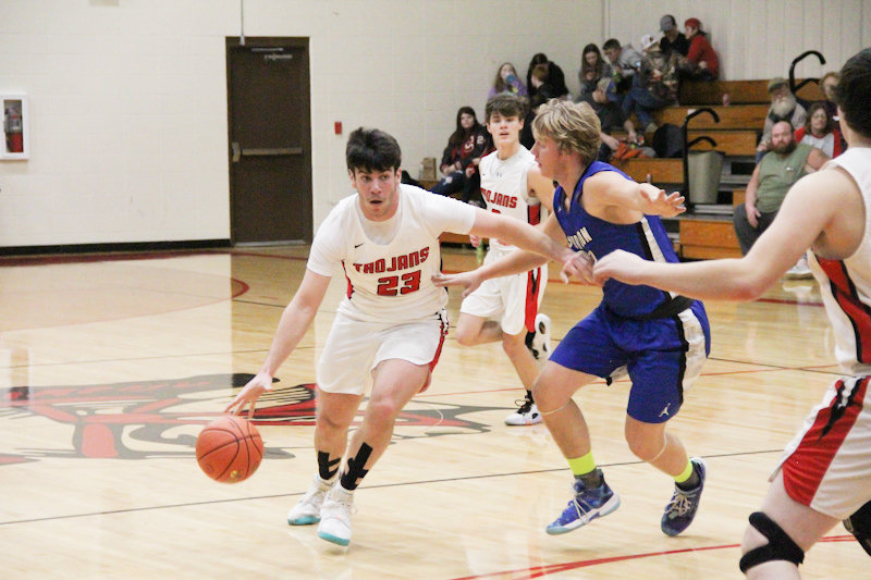 Community R-6 senior Gavin Allen dribbles around the Sturgeon defense on Tuesday at home. Allen finished with 19 points and 12 rebounds in the Senior Night win.