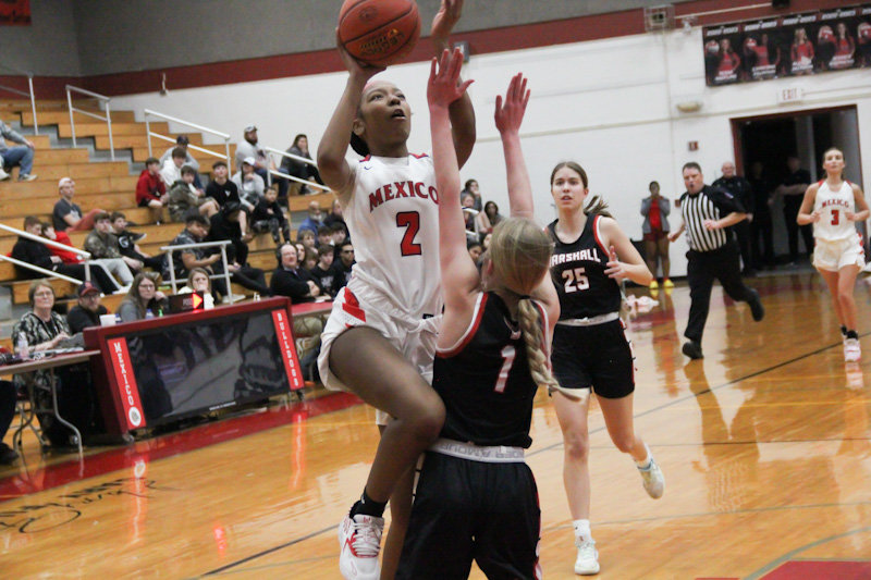 Mexico senior Messiah Simpson flies toward the rim against Marshall on Feb. 6 at home. Simpson scored all seven of her points in the third quarter in a big second half for the Lady Bulldogs.