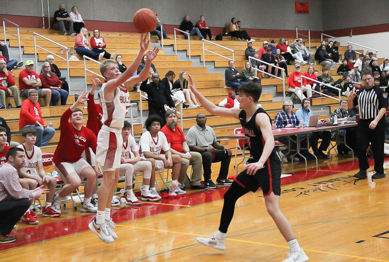 Mexico freshman Kaden Benne launches a 3-pointer Monday against Marshall at home. Benne came off the bench to knock down five 3-pointers, scoring 15 points in the 75-46 conference victory.