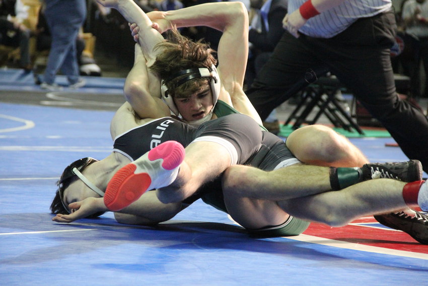 North Callaway senior Lane Kimbley contorts Centralia's Jesse Shannon's body during the 132-pound third-place match of last season's Class 1 boys state meet.