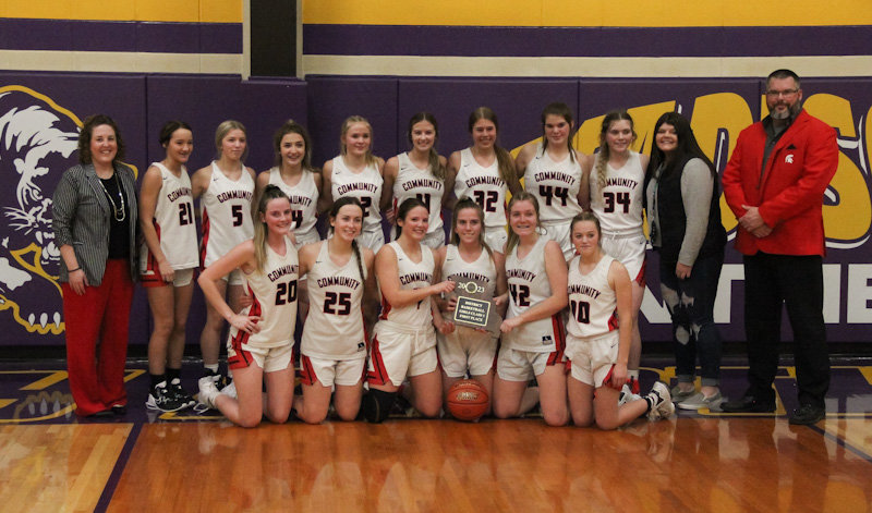 The Community R-6 Lady Trojans are district champions for the eighth time in 10 years after defeating Wellsville-Middletown 56-50 on Saturday in Madison. Pictured in the back row, from left, are assistant coach Stacie Carroz, Peyton Schafer, Peyton Beamer, Chloe Johnson, Rylee Rafferty, Kat Meyer, Jocelyn Curtis, Aaliyah Welch, manager Paige Painter, and head coach Bob Curtis. In the front row, from left, are Kylie Brooks, Brooklynn Glasgow, Kayla Jett, Sarah Angel, Olivia Kuda and Alyssa Beamer.