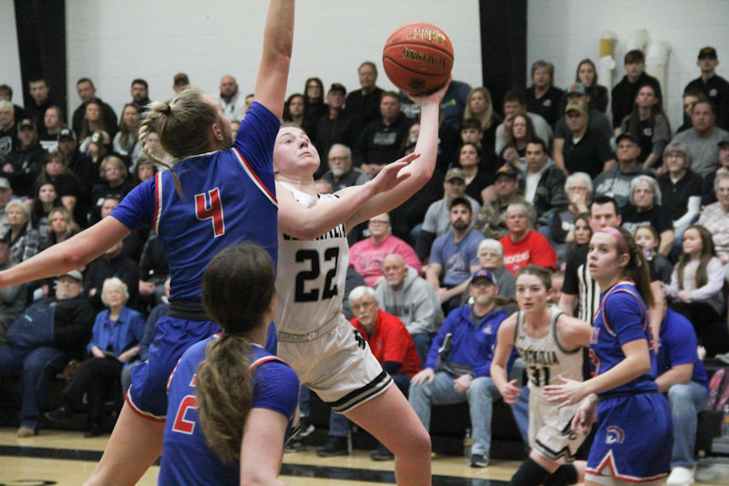 Centralia senior Annie Robinson flies around Moberly's Asa Fanning on Saturday during the Class 4 District 8 championship game in Centralia.