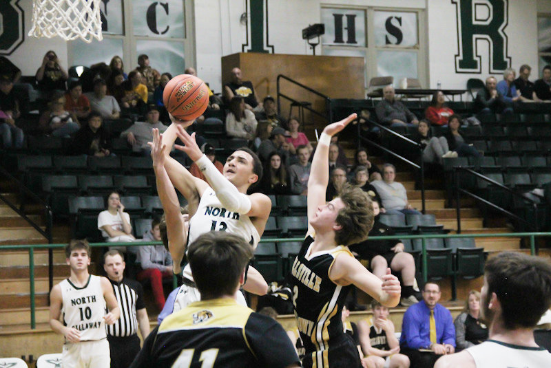North Callaway senior Matthew Weber rises to score against Wellsville-Middletown this season. Weber had a final season to remember as he became the school's all-time leading scorer during districts to splash his name all across the leaderboards.