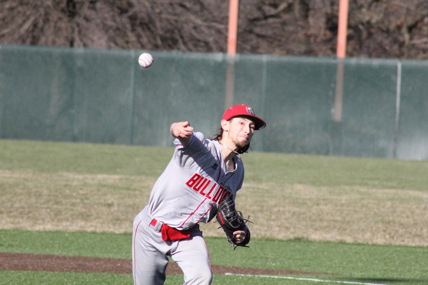 Mexico senior Jack Wilburn pitches against Moberly at home on Monday. The Bulldogs know what district their in along with all other spring student-athletes in the area.