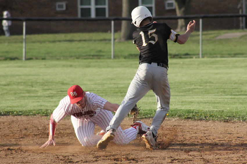 Community R-6 senior Gavin Allen tags out Van-Far senior Cody Smith trying to steal second base on Thursday in Farber. Community won 9-0.