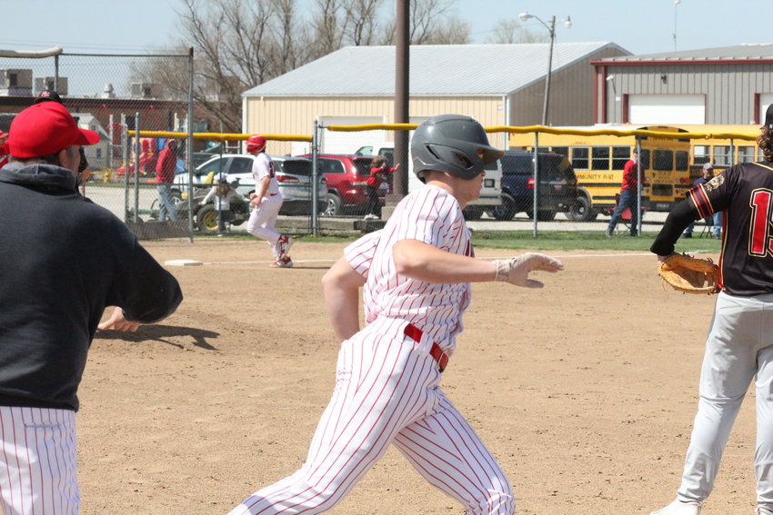 Community R-6 junior Mason Carroll rounds first base after blasting a home run on Friday at home against Prairie Home/Bunceton. The Trojans were back in Laddonia on Monday as they defeated New Haven 11-1 in five innings. Carroll hit another home run for his third of the season.