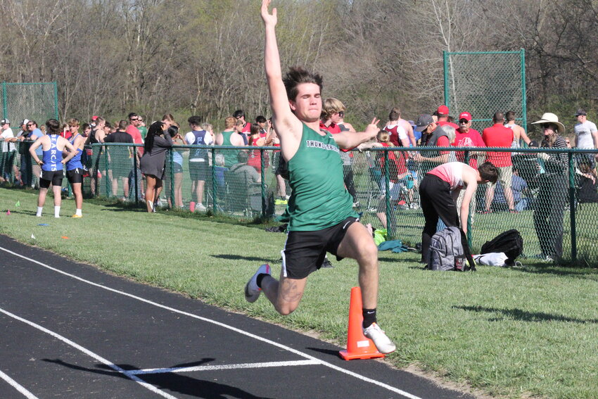 North Callaway senior Gavin Rasmussen soars in the long jump from an earlier meet at home this season. Rasmussen contributed points in several events to help the Thunderbirds win the Hermann Open on Friday.