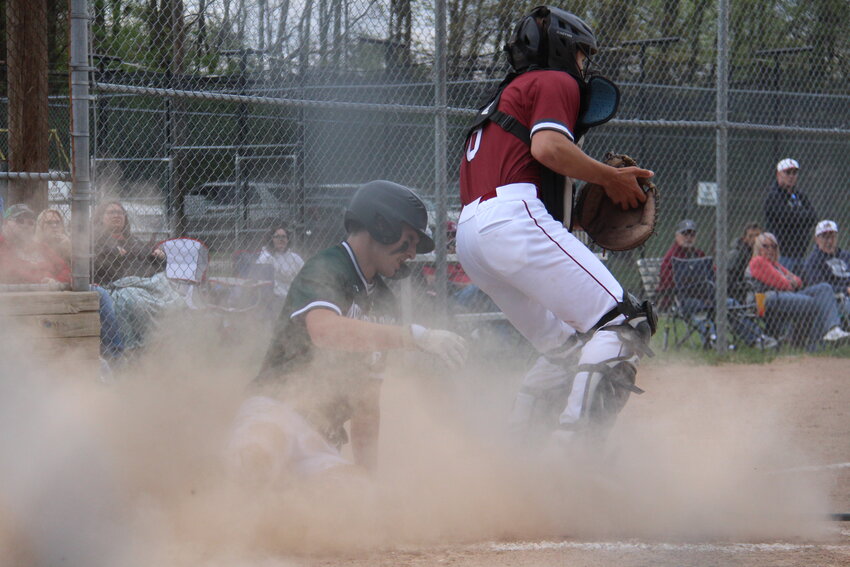 North Callaway sophomore Sam Pezold slides into home plate on Tuesday at Louisiana. The Thunderbirds won 8-3 and then defeated Silex at home on Thursday 8-4 behind Pezold's 12 strikeouts and one earned run in seven innings on the mound.