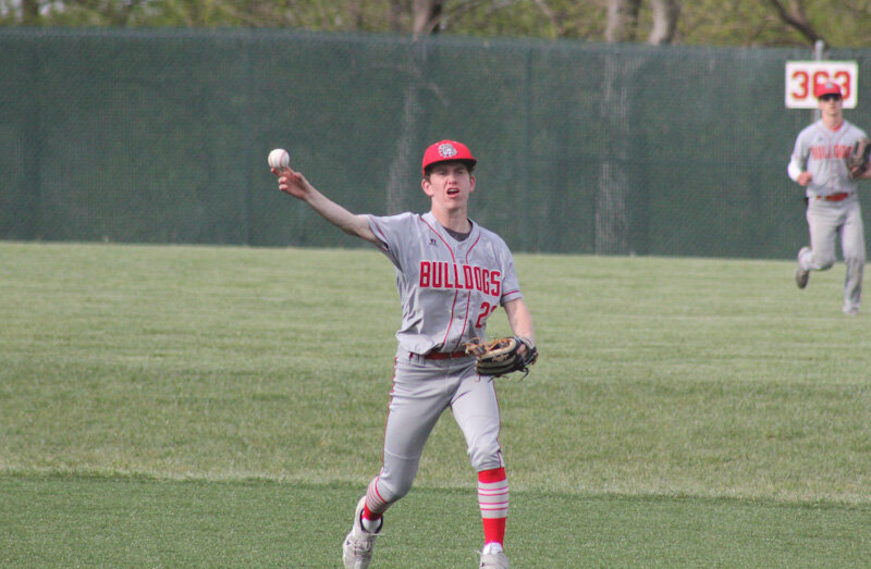 Mexico sophomore Brady Fox throws to first base for an out in a game last season.