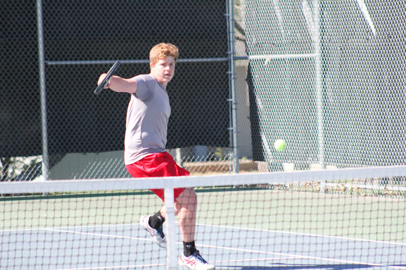 Mexico junior Brendan McKeown sends a ball back over the net last season at the North Central Missouri Conference tournament at Fairground Park in Mexico.