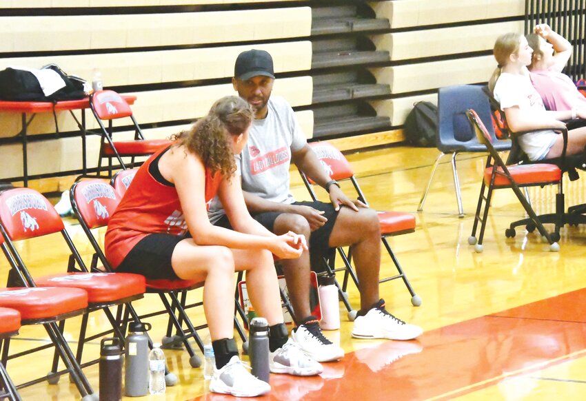 Ed Costley talks with a player during a summer league game last year. Costley officially stepped down as the Mexico girls basketball head coach late last month.