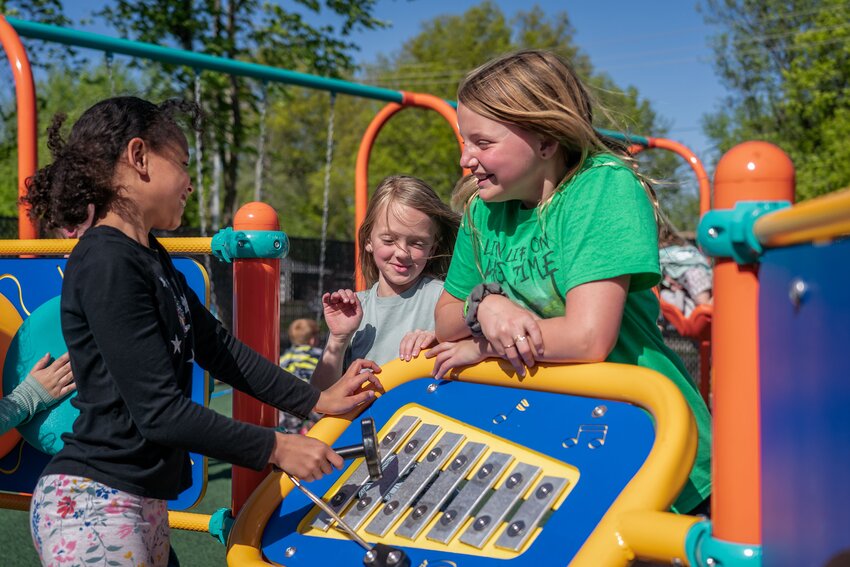 Amiya George, Hinsley Terry, Alice Fierge took advantage of a nice day to use the new playground at the YMCA.