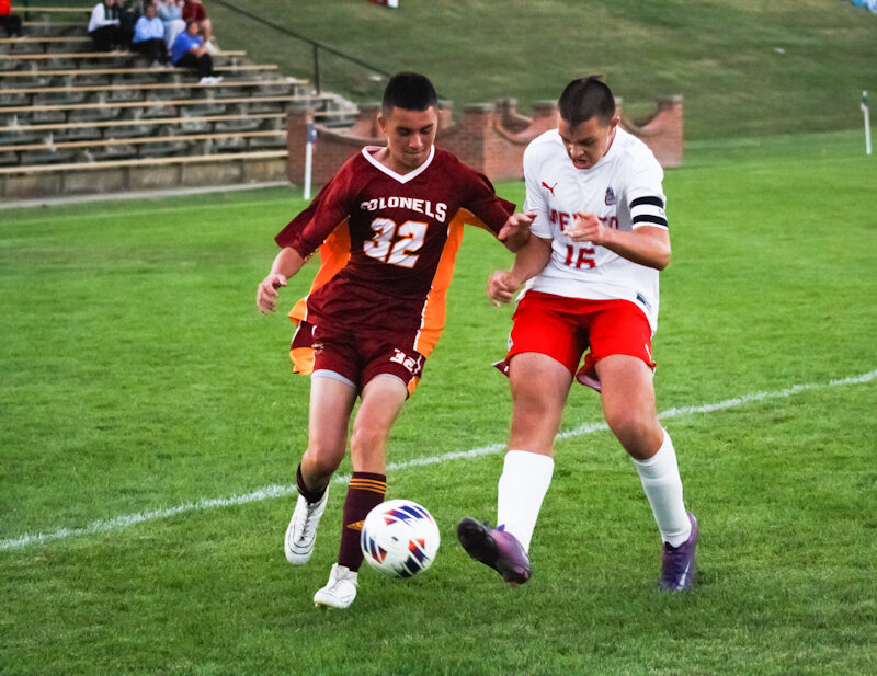 Missouri Military Academy's Nathan Dempsey pursues possession of the ball during a game last season.