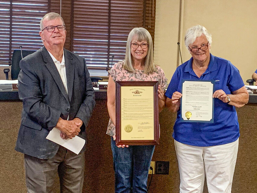Former Mexico City employee Dolly Jesse, center, was honored by State Rep. Kent Haden, left, and Mexico Mayor Vicki Briggs, right, at a regular city council meeting on Sept. 25, for her 45 years of service to the city.